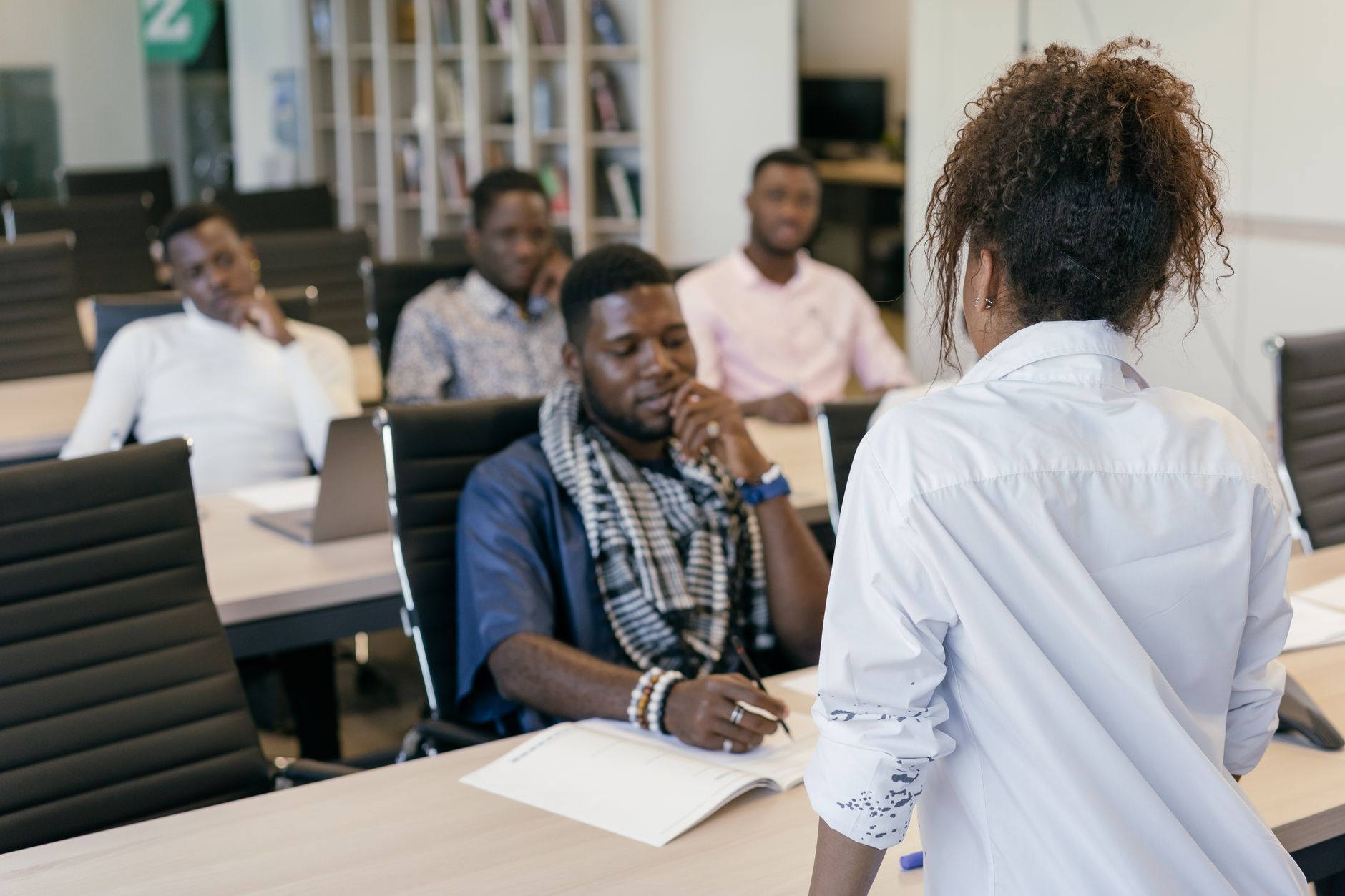 Young Nigerian professionals engaged in a corporate training workshop