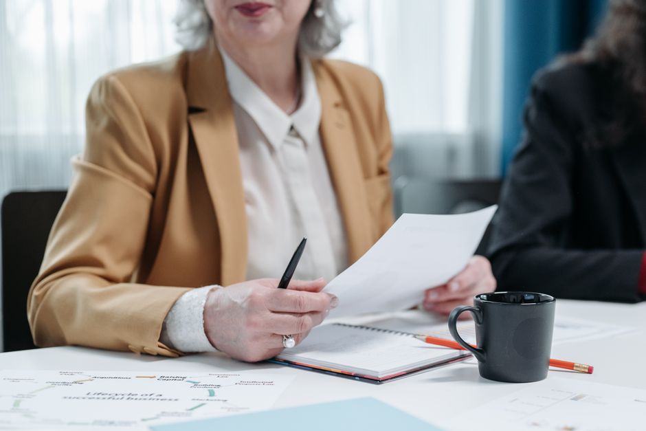 Professional reviewing workplace etiquette guide materials